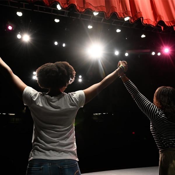 person taking bow on stage