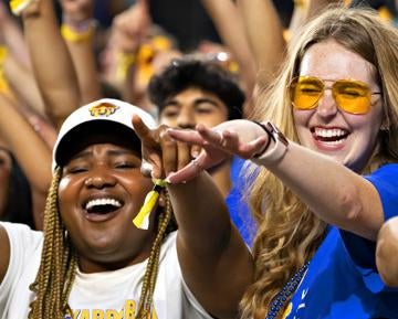 Students in crowd at athletics event