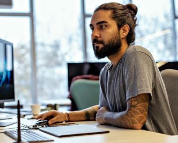 Man on computer at desk