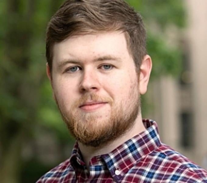 Headshot of Adam Christian outside
