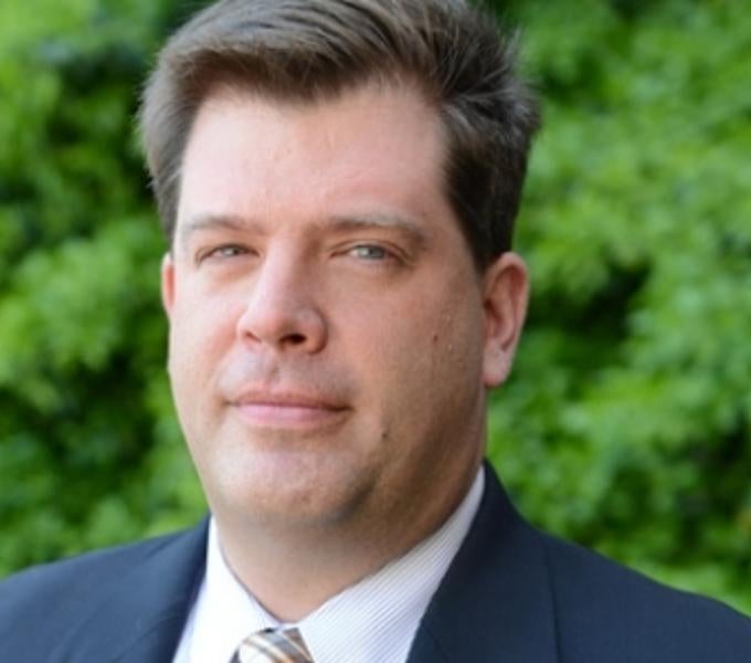 Headshot of John Cooper outside